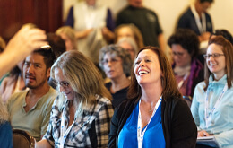 Woman laughing in conference